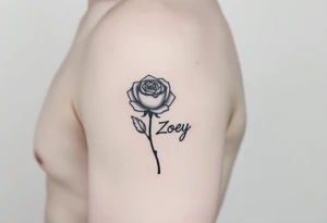 Arm tattoo with a rose and the name Zoey in cursive for the stem tattoo idea