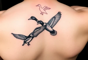 ducks flying in a swmap on outside of forearm with a wood duck and mallard tattoo idea