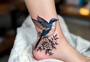 Blue bird with thick floral at the bottom tattoo idea