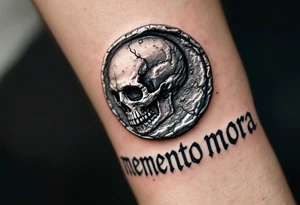 A Roman coin with a skull embossed in silver, the inscription "memento mori" in rough gray Latin lettering beneath it. tattoo idea