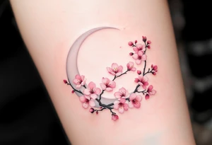 Cherry Blossom & Moon – A circular tattoo with a white crescent moon framed by a curved cherry blossom branch. Blossoms are in light pink and blush tones with soft shadows. tattoo idea