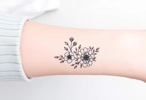 Feminine minimalist black and white bracelet/ cuff style with larkspur, peony and chrysanthemum flowers tattoo idea