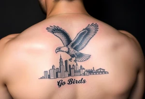 Philadelphia Eagle flying over Philadelphia city skyline faded with a Go Birds under it tattoo idea