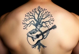 Man playing acoustic guitar underneath tree of life tattoo idea