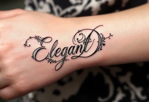 Elegant Script D – A flowing cursive letter D in black ink with delicate silver filigree details wrapping around the curves. tattoo idea