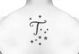 “T” in writing on hand with stars tattoo idea