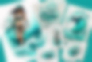 a turquoise water woman walking through crashing waves tattoo idea