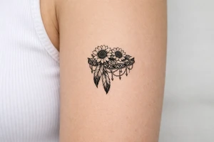 sunflowers with feathers and female Indian tribal ribbon cascading upper arm tattoo idea