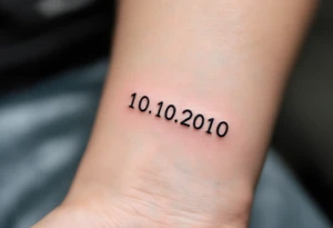 Minimalist 10.10.2010 in thin black sans serif with a small sky-blue dot between each number. tattoo idea