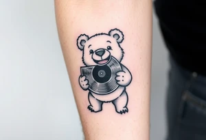 happy cartoon bear holding a vinyl record tattoo idea