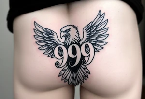 The number 999 in the middle with a majestic eagle around it on the lower thigh tattoo idea