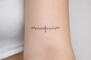 neckline tattoo along the collarbone tattoo idea