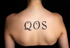 text reading "QOS" across a womb tattoo tattoo idea