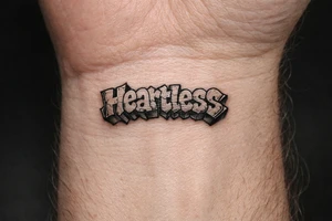 show me a tattoo of heartless with bubble letters tattoo idea