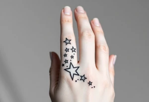 tattoo on back of hand and around fingers that includes stars and had a cool design made of lines tattoo idea