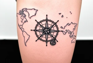 antique compass rose overlaid on weathered world map with sailing ships tattoo idea