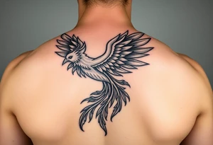 large majestic phoenix trailing with flames on an arm tattoo idea
