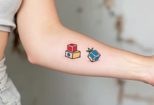 Jakoubek styled as wooden toy blocks, colored in primary red, yellow, and blue. tattoo idea