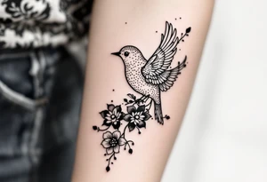 Bird with flowers tattoo idea