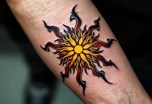 The fiery blend of red, yellow, and black in this Celtic sun tattoo creates a tribal blaze on the thigh. tattoo idea