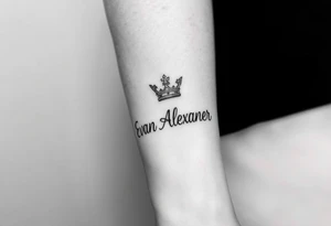 Name tattoo that says Evan Alexander with a crown on forearm tattoo idea