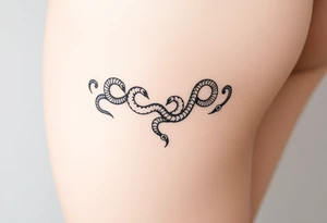 Fine-line thigh tattoo, luxury body chain made of intertwined snakes, Medusa-inspired symbolism, feminine, dainty, blackwork, hip to mid-thigh tattoo idea