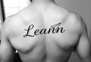 The name Leann going down my ribs with a heart and paper plane tattoo idea