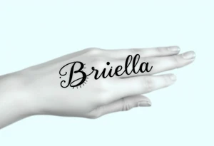 "Briella" in gangsterfont on hand along thumb tattoo idea