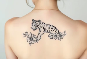 a whole tiger with some flowers around it tattoo idea