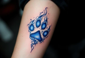A deep blue and silver Veles’ paw print, surrounded by smoke-like swirls, symbolizing magic, wilderness, and transformation. tattoo idea