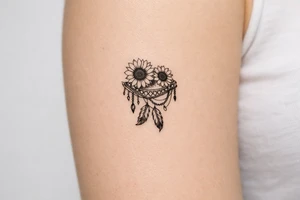 sunflowers with feathers and female Indian tribal ribbon cascading upper arm tattoo idea