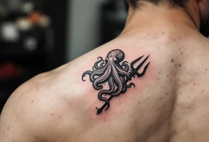 giant octopus around a trident tattoo idea