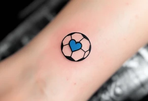A minimalist black outline of a soccer ball with a single blue heart at its center. tattoo idea