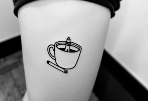 A mug of coffee
 with a picture of a 
 lighthouse on the the mug and a cigarette laying next to it tattoo idea