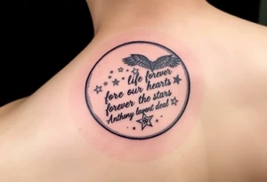Big half moon with writing inside saying Forever in our hearts forever in the stars 
RIP 
ANTHONY LAMONT DEAL tattoo idea