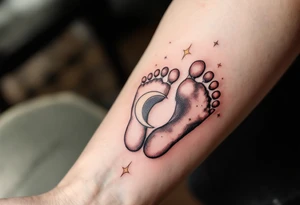 Soft peach and white footprints of Laura, with a whimsical moon cradling the prints, as a reminder of her gentle dreams. tattoo idea