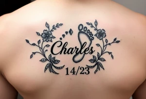 Baby footprint surrounded by the name Charles and the date 1/14/23 and floral vines tattoo idea