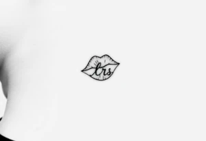 kiss mark tattooed on the neck with the initials lrs beside it tattoo idea