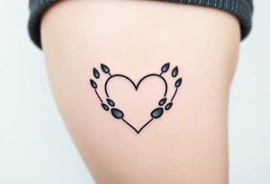 Paw prints forming heart in a snow tattoo idea