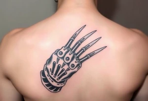 Freddy Krueger showing his claw
Q tattoo idea