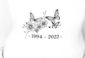 flowers and butterflies with the name “NANA” and the date “1954-2022” mixed all together on the side of the rib cage tattoo idea