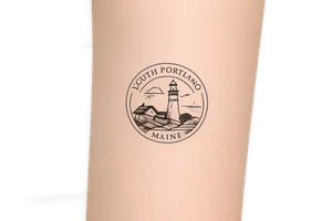 South Portland maine city circular symbol with lighthouse on it tattoo idea