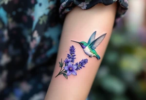 A hummingbird hovering near blooming lavender flowers, with shimmering emerald and violet tones. tattoo idea