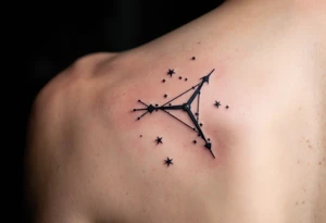 Sagittarius star constellation tattoo in muted grays and whites, placed along the spine. tattoo idea