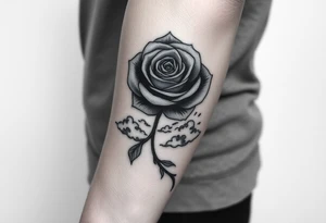 A tattoo on the forearm with a rose that goes around the forearm with space to put clouds red ink with a palm tattoo idea