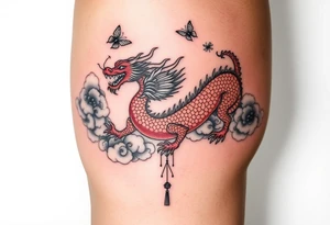 Red Chinese dragon thigh tattoo surrounded by clouds and butterflies.. make it cohesive tattoo idea