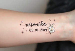 Veronika 05. 01. 2019) – Soft white lilies framing Veronika’s birthdate, accented by silver twinkling stars and gentle, sparkling details. tattoo idea