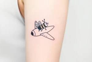 jet plane with a bee flying with it tattoo idea