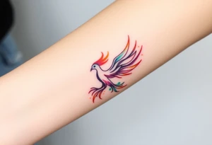 Phoenix with blazing flames with purple, orange, teal and green splashes tattoo idea