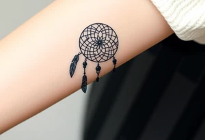 native dreamcatcher with flowing feathers and sacred beads tattoo idea